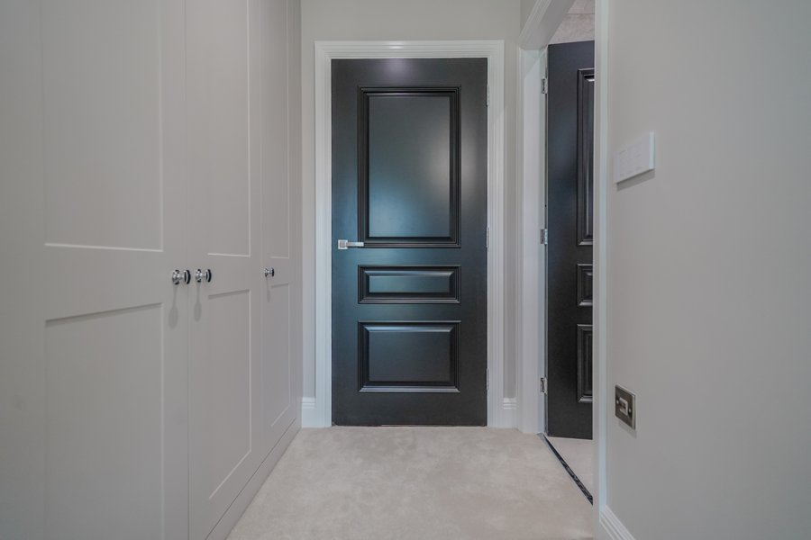Joinery detail — panelled doors and fitted storage